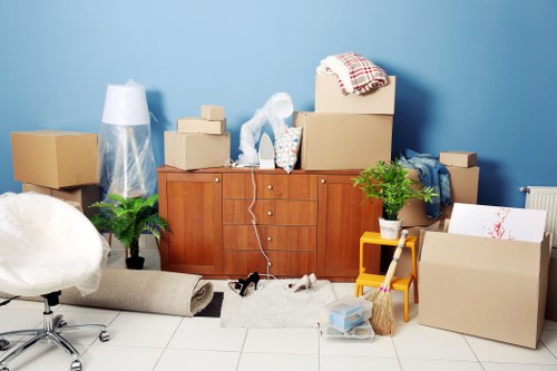 Commercial moving professionals handling office equipment